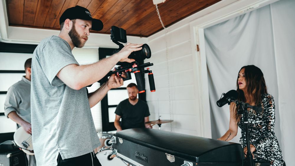 Man Taking Video of Woman Playing Piano Photo by Kyle Loftus from Pexels